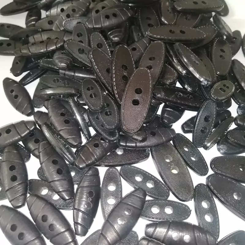 دکمه لباس پالتو  بیضی مشکی کوچک در بسته 10 عددی